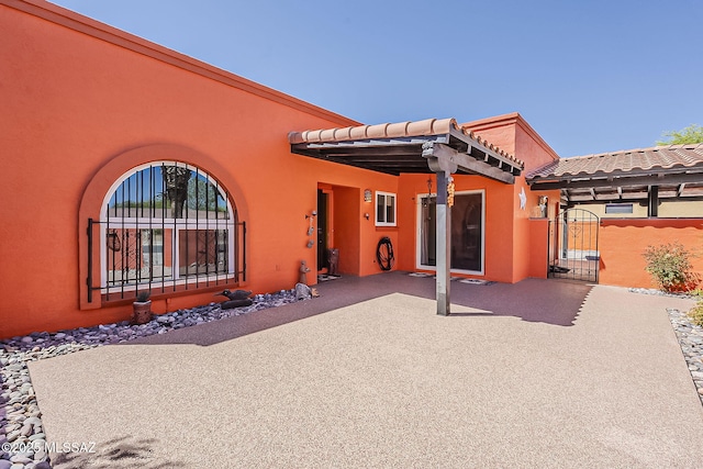 241 W Calle Mccleary, Green Valley, AZ 85614 - rear view of property featuring a gate, stucco siding, a patio, and fence