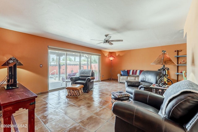 241 W Calle Mccleary, Green Valley, AZ 85614 - living room featuring ceiling fan, baseboards, and light tile patterned floors