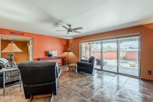 241 W Calle Mccleary, Green Valley, AZ 85614 - living area with a ceiling fan, tile patterned floors, and baseboards