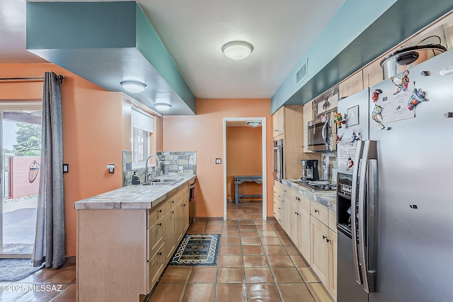 241 W Calle Mccleary, Green Valley, AZ 85614 - kitchen featuring appliances with stainless steel finishes, a sink, tasteful backsplash, and healthy amount of natural light