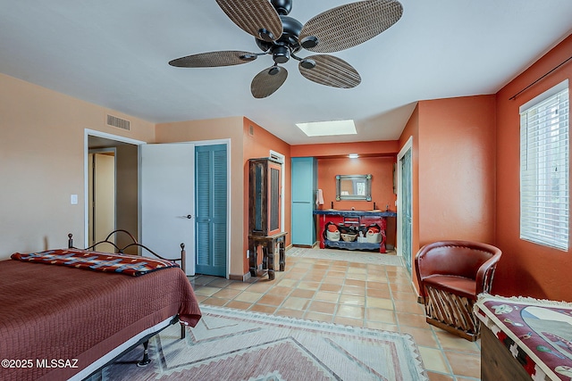 241 W Calle Mccleary, Green Valley, AZ 85614 - bedroom featuring a skylight, a ceiling fan, light tile patterned floors, and a closet