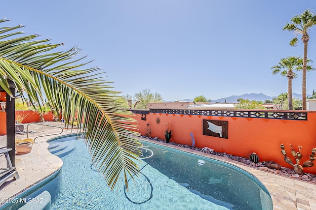 241 W Calle Mccleary, Green Valley, AZ 85614 - view of swimming pool with a mountain view and a patio