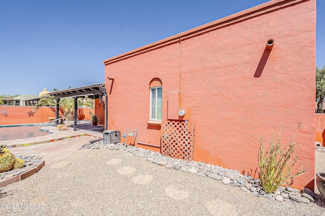 241 W Calle Mccleary, Green Valley, AZ 85614 - view of property exterior with a patio, a fenced backyard, and stucco siding