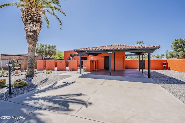 241 W Calle Mccleary, Green Valley, AZ 85614 - view of front of property with fence, stucco siding, a tile roof, concrete driveway, and a gate