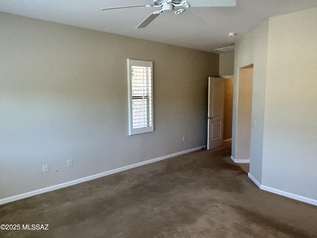 60422 E Arroyo Vista Dr, Oracle, AZ 85623 - spare room with a ceiling fan, baseboards, and dark colored carpet