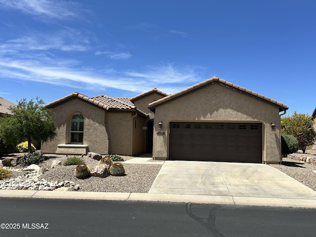 60422 E Arroyo Vista Dr, Oracle, AZ 85623 - mediterranean / spanish-style house featuring a garage, driveway, stucco siding, and a tiled roof