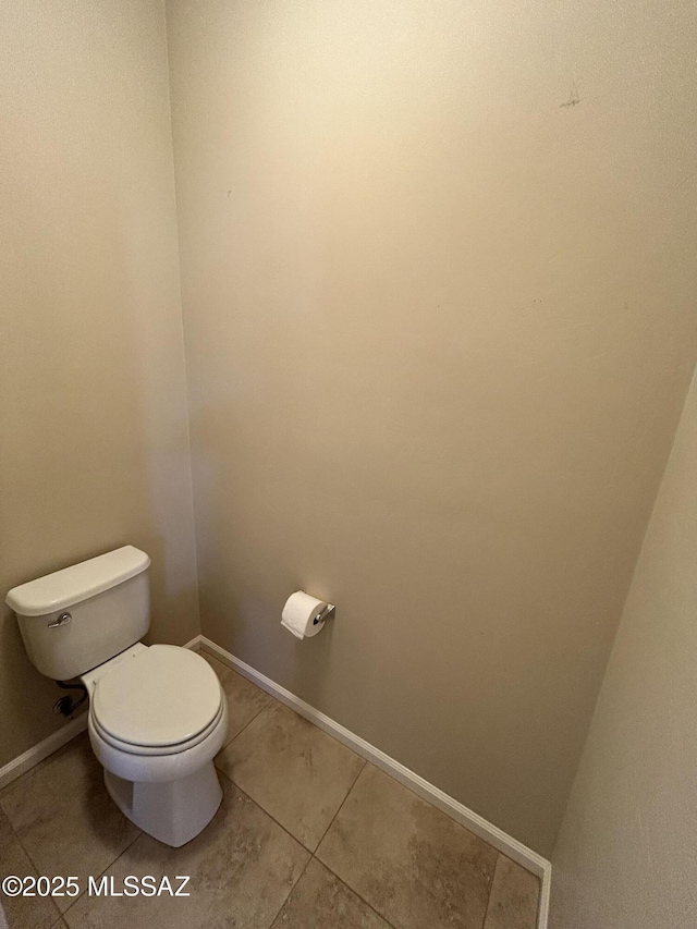 60422 E Arroyo Vista Dr, Oracle, AZ 85623 - bathroom with toilet, tile patterned flooring, and baseboards