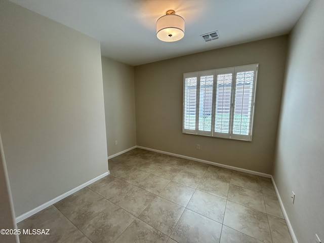 60422 E Arroyo Vista Dr, Oracle, AZ 85623 - empty room with light tile patterned floors and baseboards
