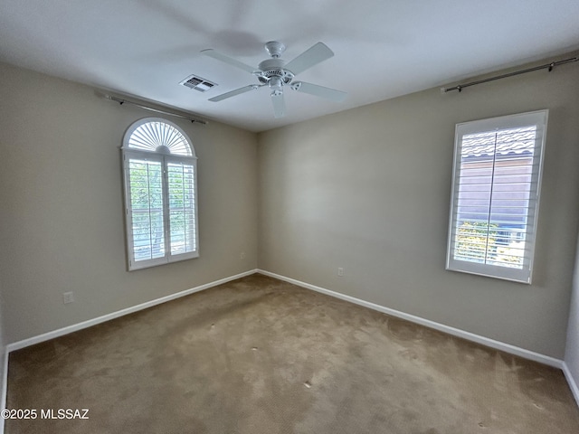 60422 E Arroyo Vista Dr, Oracle, AZ 85623 - carpeted spare room featuring ceiling fan and baseboards