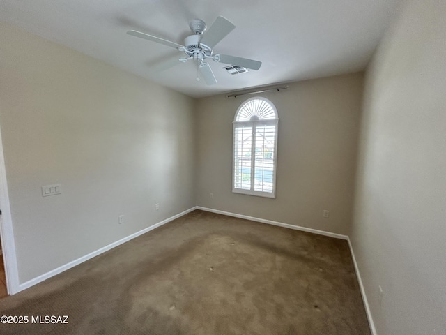 60422 E Arroyo Vista Dr, Oracle, AZ 85623 - carpeted spare room with baseboards and a ceiling fan
