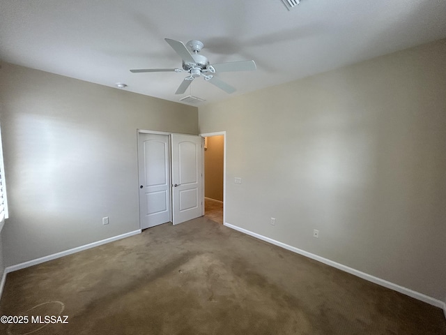 60422 E Arroyo Vista Dr, Oracle, AZ 85623 - unfurnished bedroom featuring baseboards, carpet, a closet, and ceiling fan