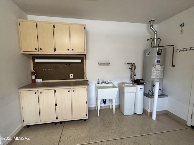 60422 E Arroyo Vista Dr, Oracle, AZ 85623 - laundry area with water heater, cabinet space, and baseboards