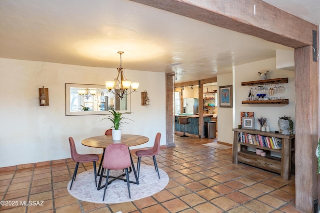 2120 N Fair Oaks Ave, Tucson, AZ 85712 - dining space featuring a chandelier and baseboards