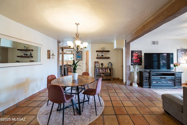 2120 N Fair Oaks Ave, Tucson, AZ 85712 - dining space featuring a chandelier and baseboards