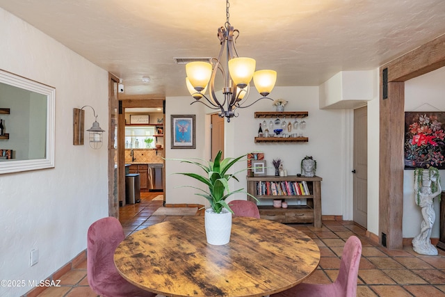 2120 N Fair Oaks Ave, Tucson, AZ 85712 - dining space with a chandelier, baseboards, and tile patterned floors