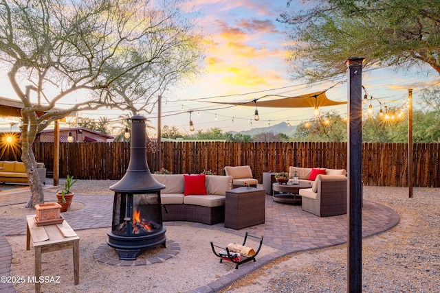 2120 N Fair Oaks Ave, Tucson, AZ 85712 - fenced backyard with an outdoor living space with a fire pit and a patio area