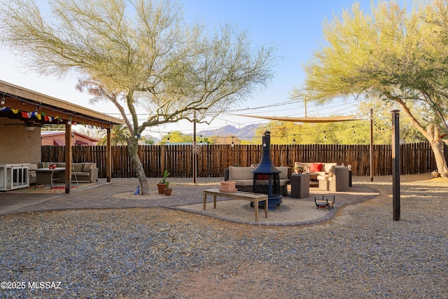 2120 N Fair Oaks Ave, Tucson, AZ 85712 - fenced backyard featuring an outdoor hangout area, a patio area, and a ceiling fan