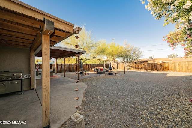 2120 N Fair Oaks Ave, Tucson, AZ 85712 - fenced backyard with outdoor lounge area and a patio area
