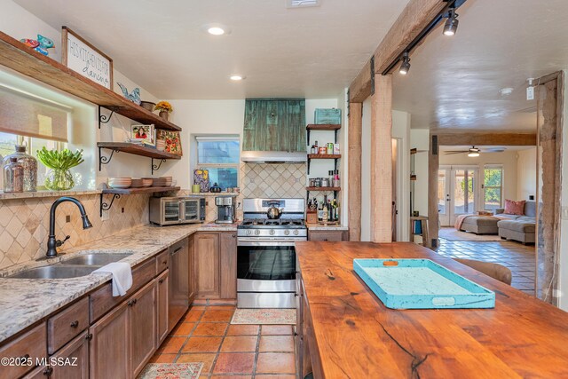 2120 N Fair Oaks Ave, Tucson, AZ 85712 - kitchen with butcher block countertops, open shelves, stainless steel appliances, a sink, and recessed lighting