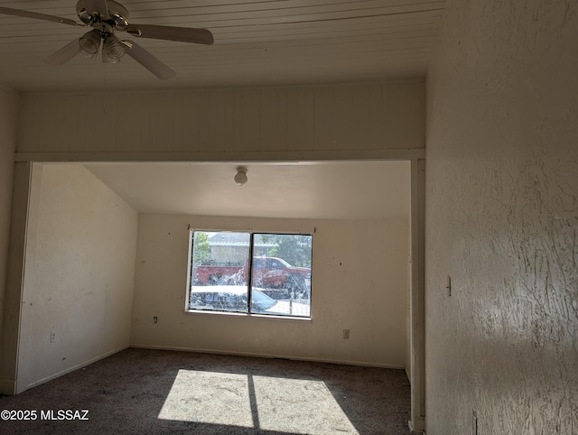 empty room featuring carpet, ceiling fan, and baseboards