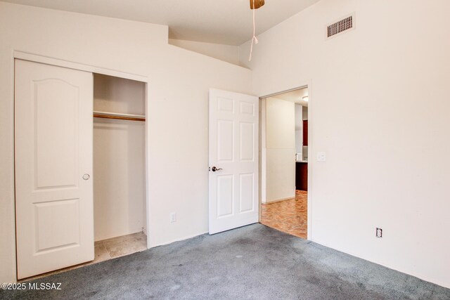 8145 E Smooth Sumac Ln, Tucson, AZ 85710 - unfurnished bedroom featuring carpet flooring, a closet, and vaulted ceiling