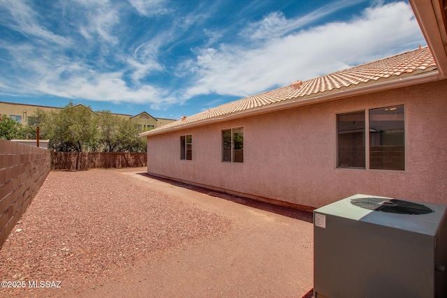 8145 E Smooth Sumac Ln, Tucson, AZ 85710 - view of property exterior with a fenced backyard, a tile roof, and stucco siding