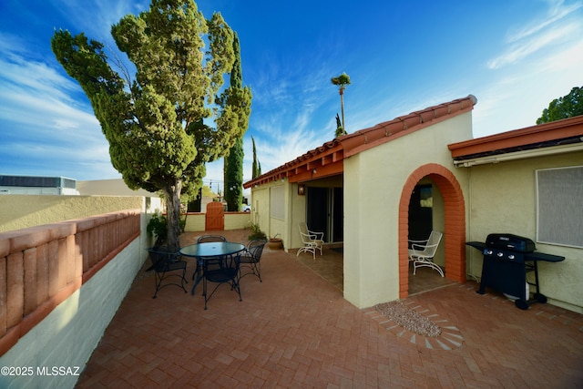 980 W Camino Sagasta, Green Valley, AZ 85622 - view of patio featuring outdoor dining space, grilling area, and fence