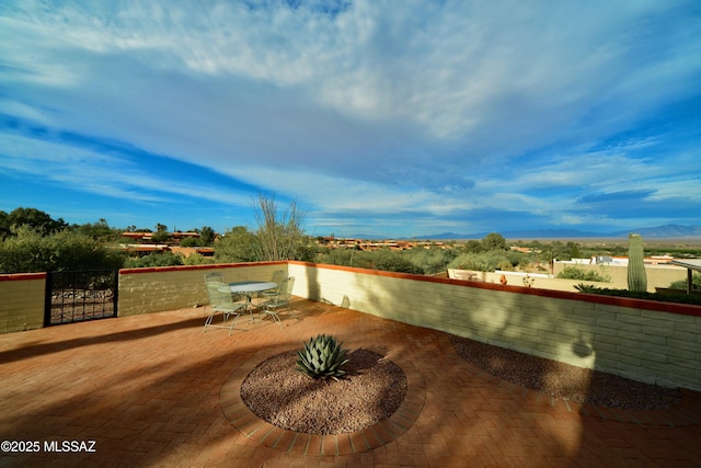 980 W Camino Sagasta, Green Valley, AZ 85622 - view of patio with a mountain view, fence, and outdoor dining area