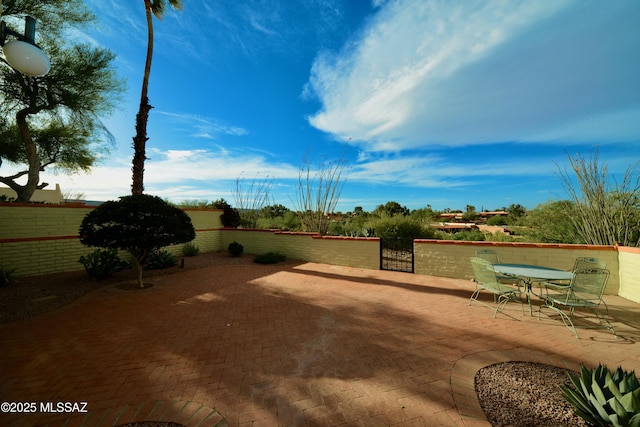 980 W Camino Sagasta, Green Valley, AZ 85622 - view of patio / terrace featuring fence and outdoor dining area