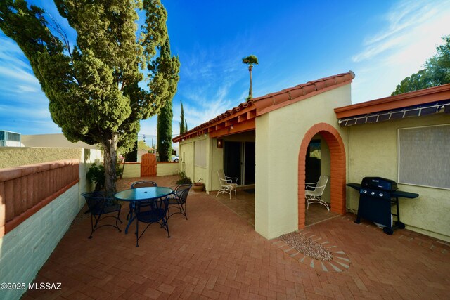 980 W Camino Sagasta, Green Valley, AZ 85622 - view of patio / terrace featuring outdoor dining area, grilling area, and fence