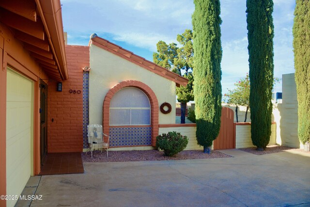 980 W Camino Sagasta, Green Valley, AZ 85622 - view of side of home featuring fence