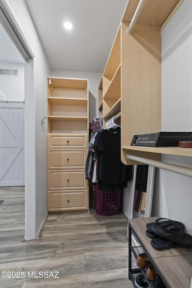519 W Silvertip Rd, Tucson, AZ 85737 - spacious closet with wood finished floors