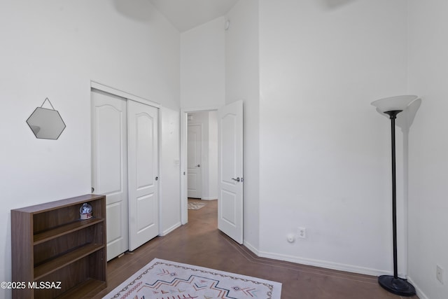 519 W Silvertip Rd, Tucson, AZ 85737 - unfurnished bedroom with a high ceiling, baseboards, and a closet