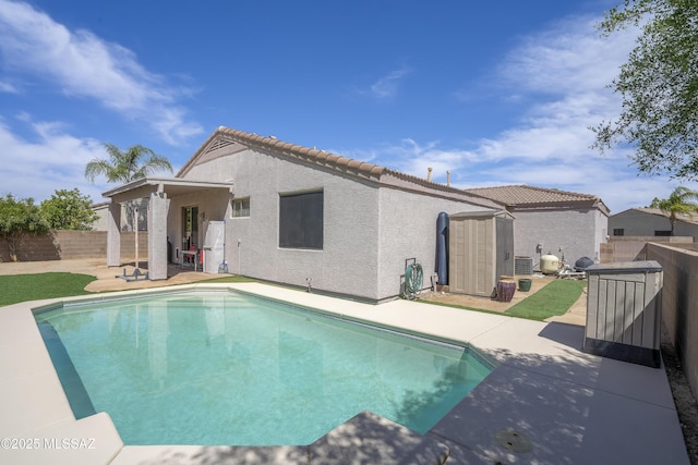 519 W Silvertip Rd, Tucson, AZ 85737 - view of pool with a patio area, a fenced backyard, and central AC unit