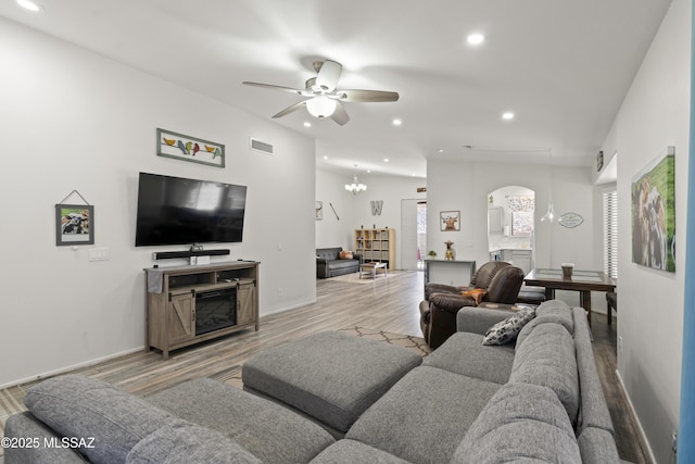 519 W Silvertip Rd, Tucson, AZ 85737 - living room featuring arched walkways, wood finished floors, a ceiling fan, recessed lighting, and baseboards