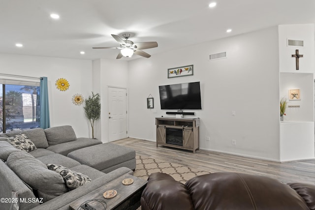 519 W Silvertip Rd, Tucson, AZ 85737 - living area featuring ceiling fan, recessed lighting, wood finished floors, baseboards, and a fireplace