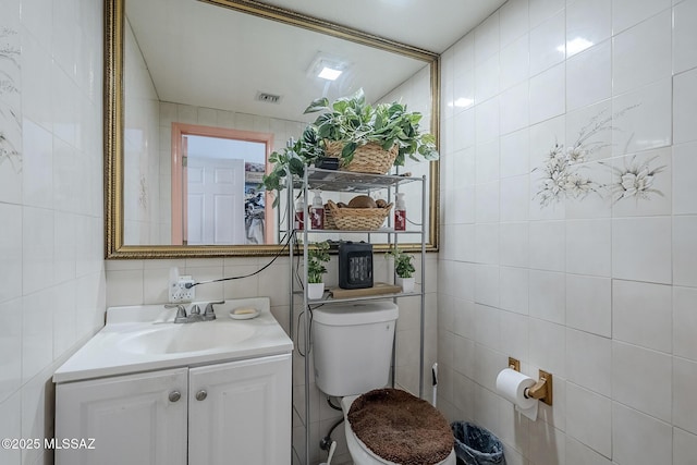 333 Valley View Dr, Rio Rico, AZ 85648 - half bath featuring tile walls, toilet, and vanity