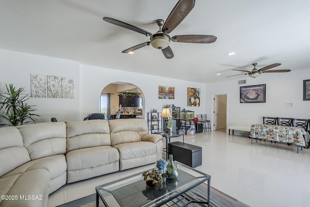 333 Valley View Dr, Rio Rico, AZ 85648 - living room with arched walkways, ceiling fan, tile patterned flooring, and recessed lighting