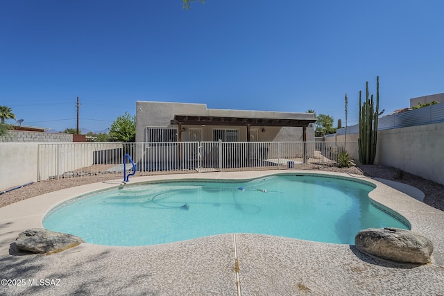 view of swimming pool with a fenced backyard and a patio