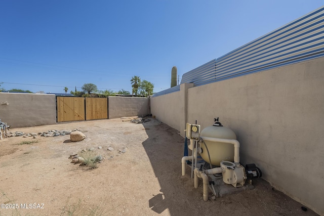 view of yard with a gate