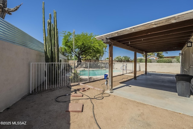 fenced backyard with a patio area