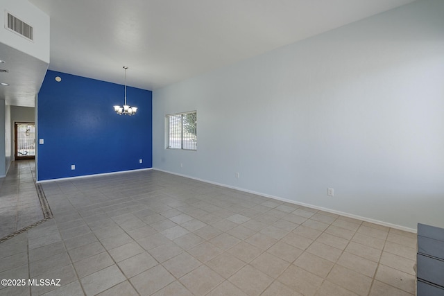unfurnished room with a chandelier, light tile patterned floors, and baseboards