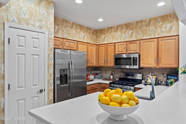 472 W Calle Sedillo, Sahuarita, AZ 85629 - kitchen with appliances with stainless steel finishes, light countertops, recessed lighting, backsplash, and brown cabinetry