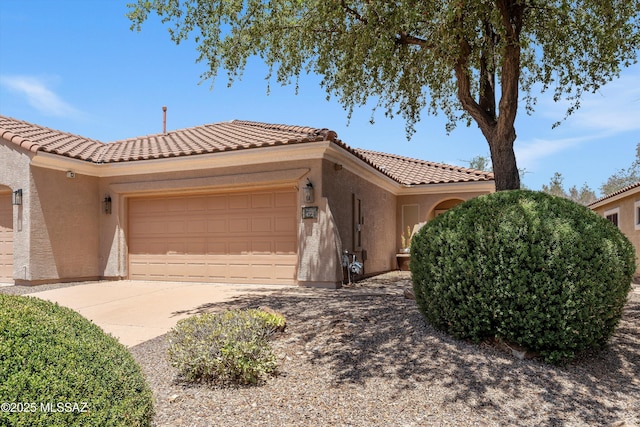 472 W Calle Sedillo, Sahuarita, AZ 85629 - view of front of home with stucco siding, a garage, a tile roof, and driveway