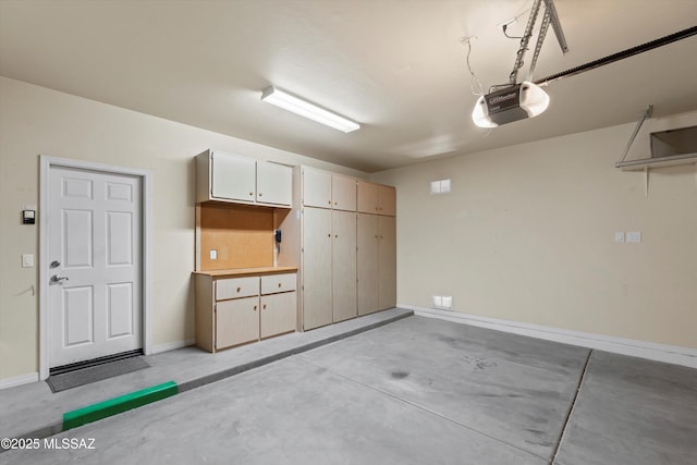 472 W Calle Sedillo, Sahuarita, AZ 85629 - garage featuring a garage door opener and baseboards