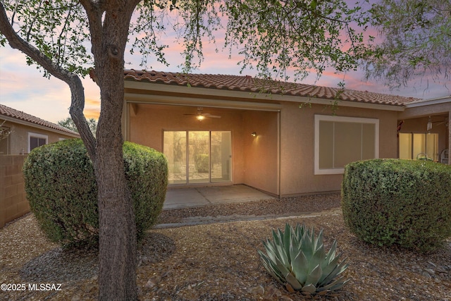 472 W Calle Sedillo, Sahuarita, AZ 85629 - view of front facade with a tile roof, stucco siding, a patio area, and fence