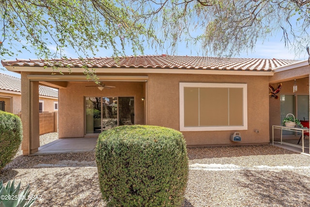 472 W Calle Sedillo, Sahuarita, AZ 85629 - back of property with a patio area, a ceiling fan, stucco siding, a tiled roof, and fence