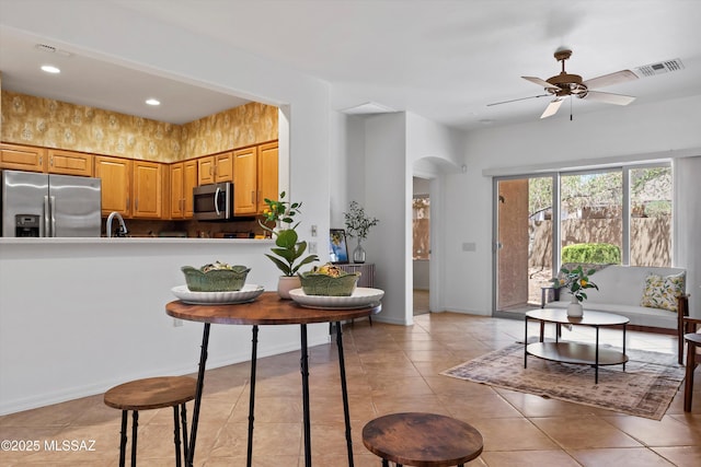 472 W Calle Sedillo, Sahuarita, AZ 85629 - kitchen with appliances with stainless steel finishes, arched walkways, ceiling fan, light tile patterned flooring, and recessed lighting
