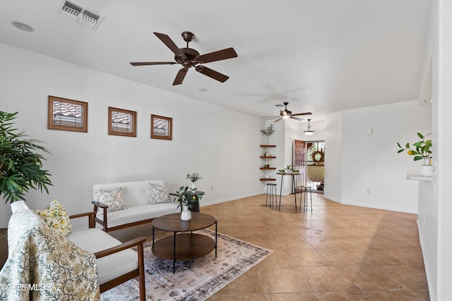 472 W Calle Sedillo, Sahuarita, AZ 85629 - living room featuring ceiling fan, light tile patterned floors, and baseboards