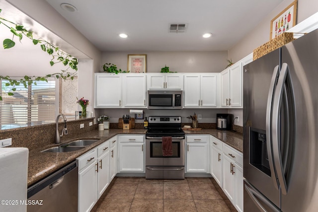 21185 E Reunion Rd, Red Rock, AZ 85145 - kitchen featuring stainless steel appliances, a sink, white cabinetry, and recessed lighting